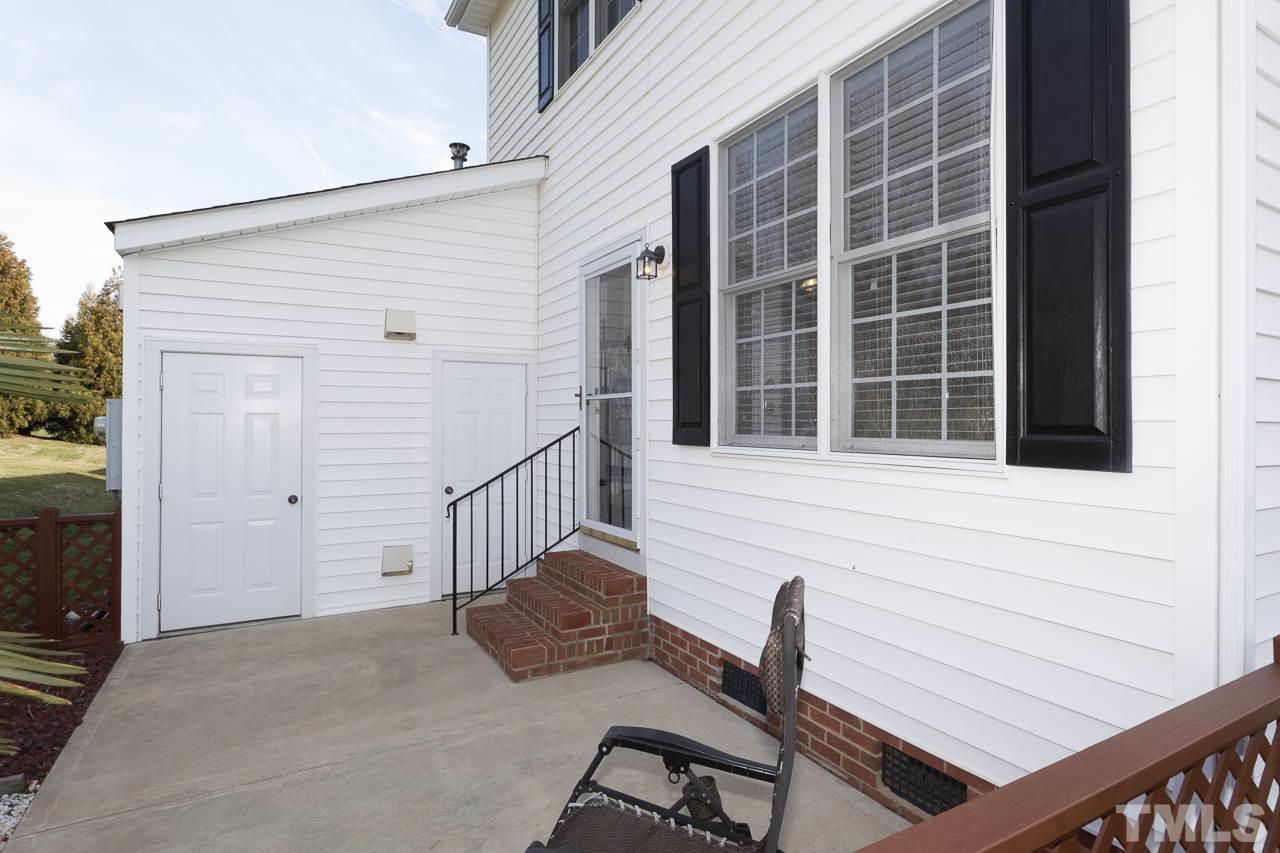 5410 Goldenglow Way Raleigh, NC 27606 - Photo 22 of 24 a view of a chair and table in the balcony