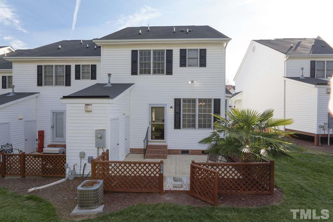 5410 Goldenglow Way Raleigh, NC 27606 - Photo 23 of 24 a front view of a house with a garden