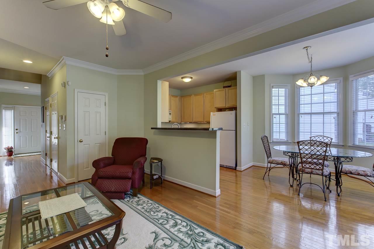 5410 Goldenglow Way Raleigh, NC 27606 - Photo 7 of 24 a living room with furniture and a chandelier