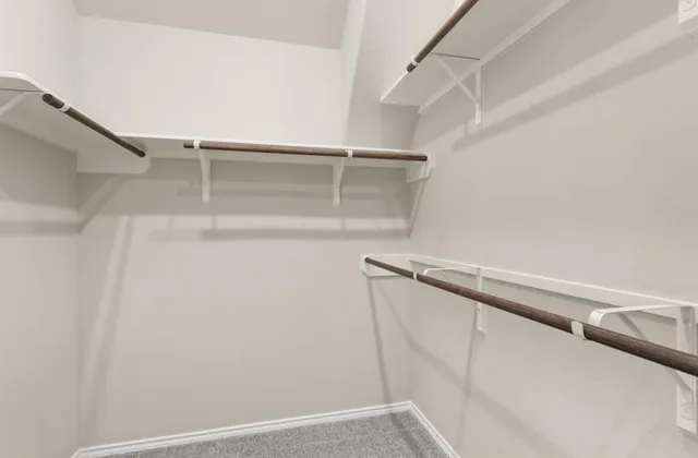 a view of an empty walk in closet