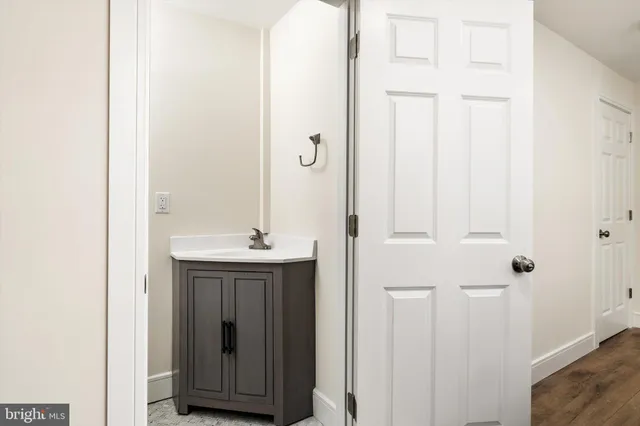 a bathroom with a sink and mirror