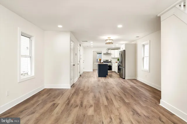 a view of kitchen with furniture and wooden floor