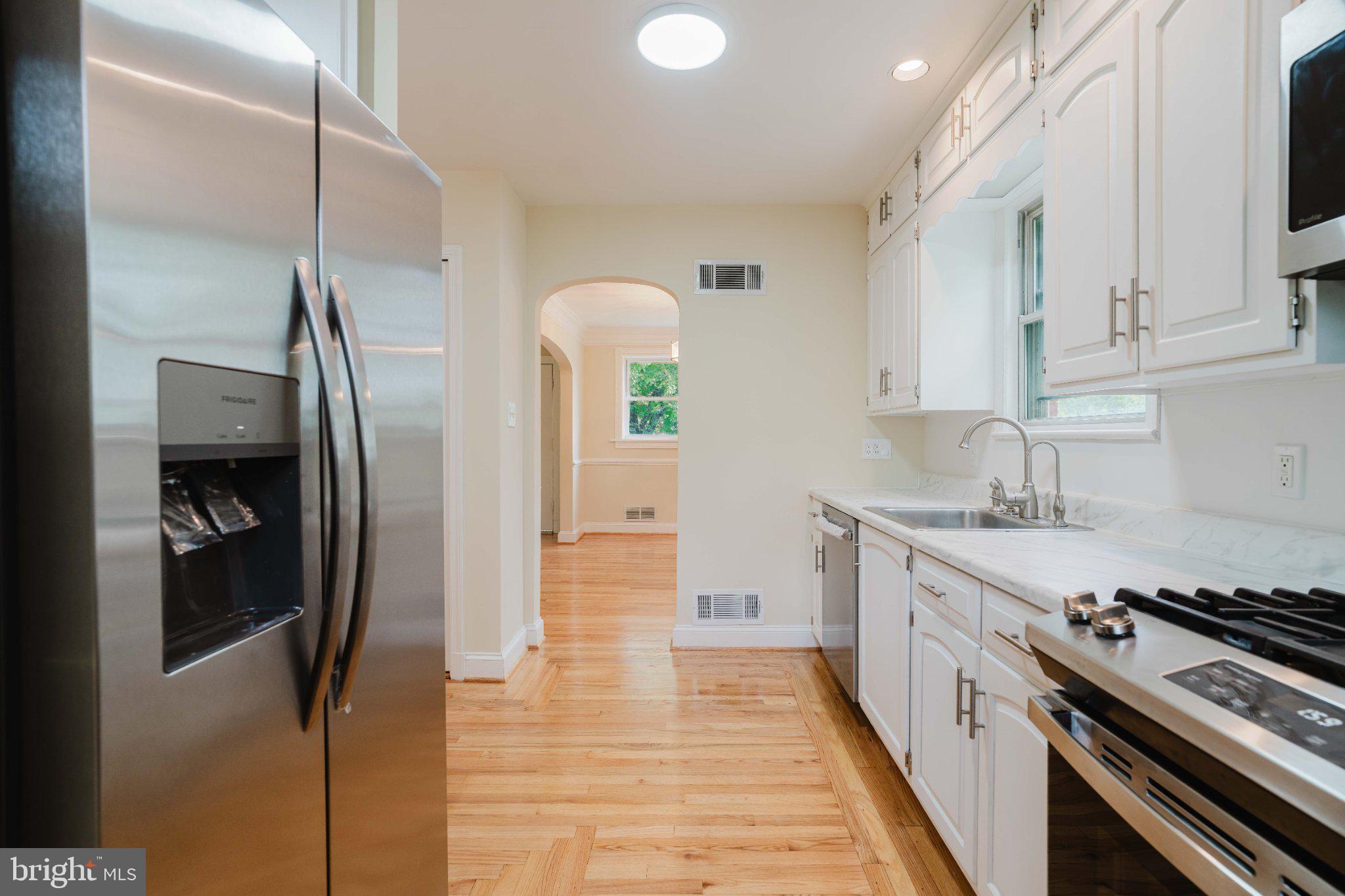 10200 Duvawn Place Silver Spring, MD 20902 - Photo 8 of 42 Bright and airy kitchen space.