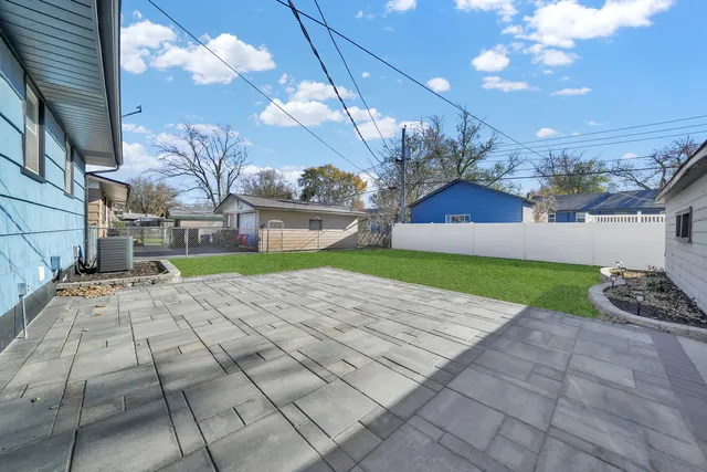 a view of a backyard of the house