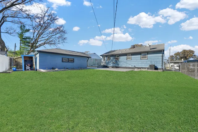 a large kitchen with a large tree