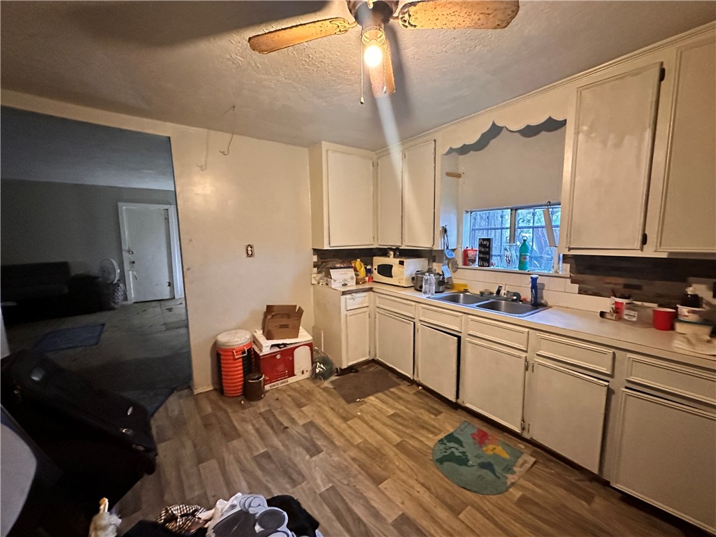 525 Eubanks Street Houston, TX 77022 - Photo 2 of 4 a kitchen with a sink appliances and cabinets