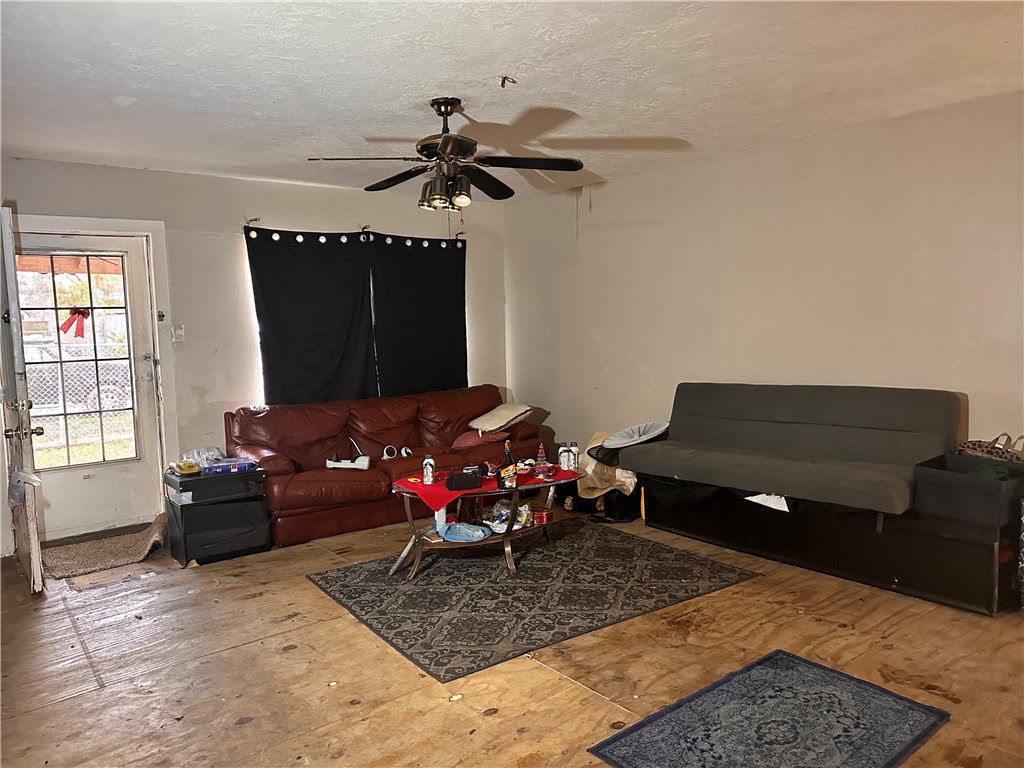 525 Eubanks Street Houston, TX 77022 - Photo 3 of 4 a living room with furniture and a flat screen tv