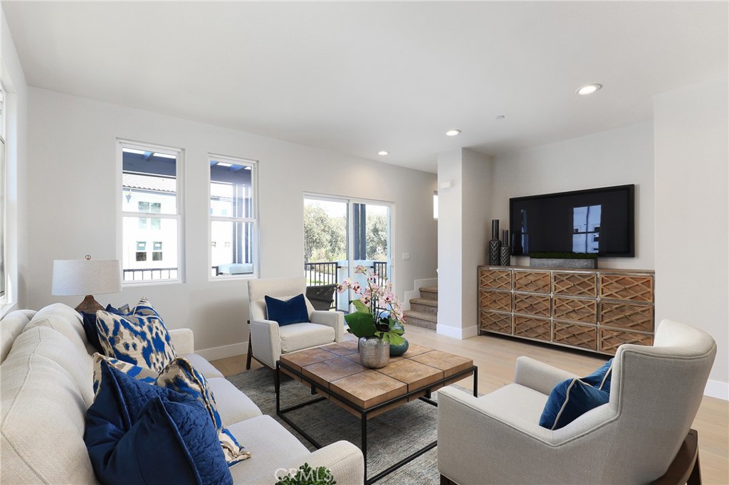 1 Spyglass Avenue Phillips Ranch, CA 91766 - Photo 12 of 63 a living room with furniture and a flat screen tv
