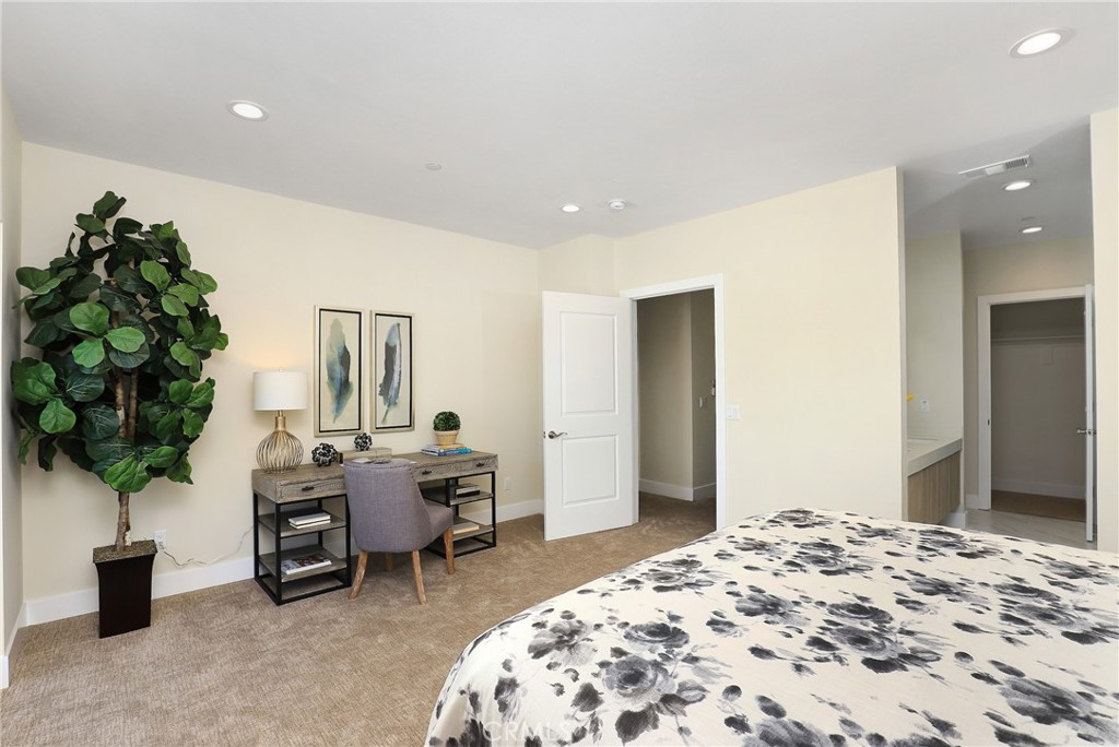 1 Spyglass Avenue Phillips Ranch, CA 91766 - Photo 26 of 63 a bedroom with a bed and a potted plant