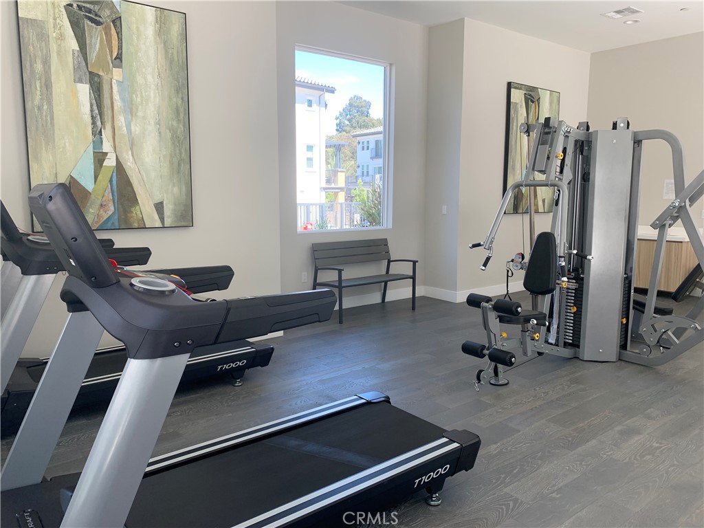1 Spyglass Avenue Phillips Ranch, CA 91766 - Photo 52 of 63 a room with gym equipment and a large window
