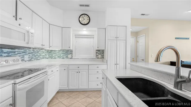 $450,000 | 73 Evergreen Condo Drive, Unit 2A, Sunrise Beach, MO 65079