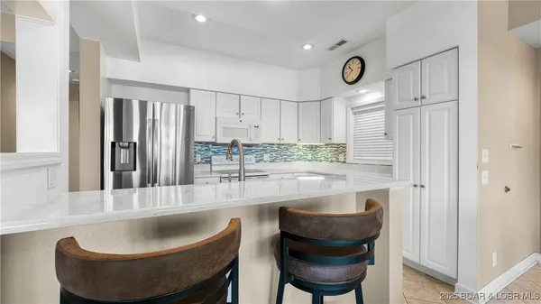 $450,000 | 73 Evergreen Condo Drive, Unit 2A, Sunrise Beach, MO 65079