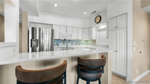 $450,000 | 73 Evergreen Condo Drive, Unit 2A, Sunrise Beach, MO 65079