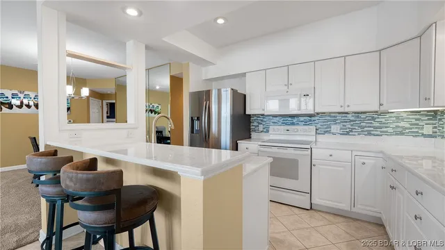 $450,000 | 73 Evergreen Condo Drive, Unit 2A, Sunrise Beach, MO 65079