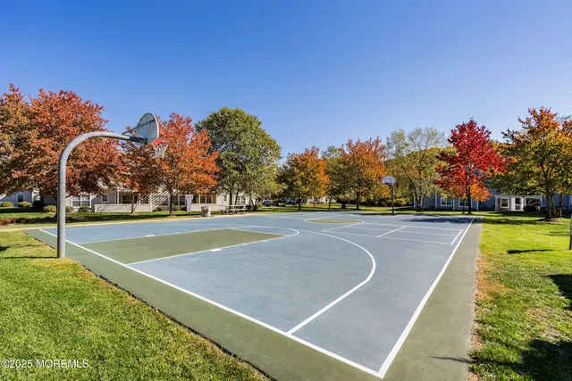 a view of a swimming pool with an outdoor space and seating area