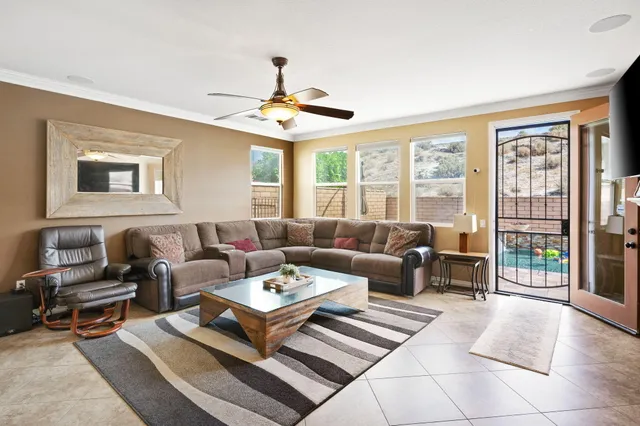a living room with furniture and a large window