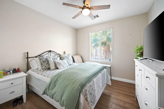 a bedroom with a bed and a dresser