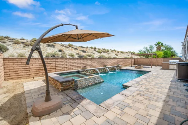 a view of swimming pool with lounge chair