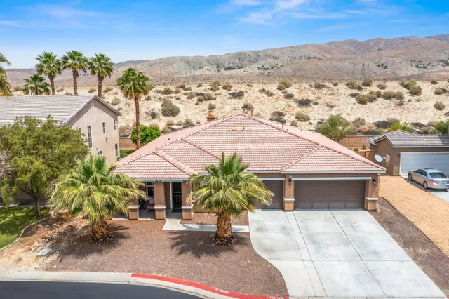a view of house with outdoor space and sitting area
