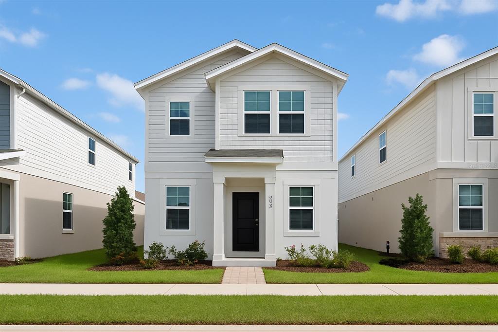 a front view of a house with a yard