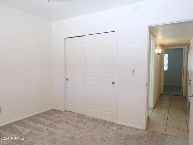 a bathroom with a granite countertop sink a toilet and a bathtub
