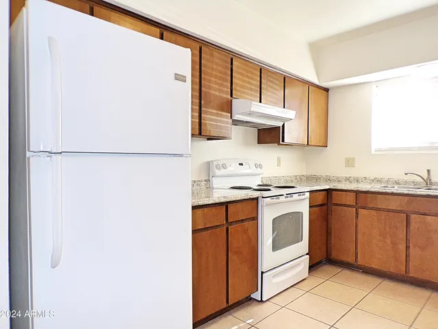 a view of a closet area with an empty room