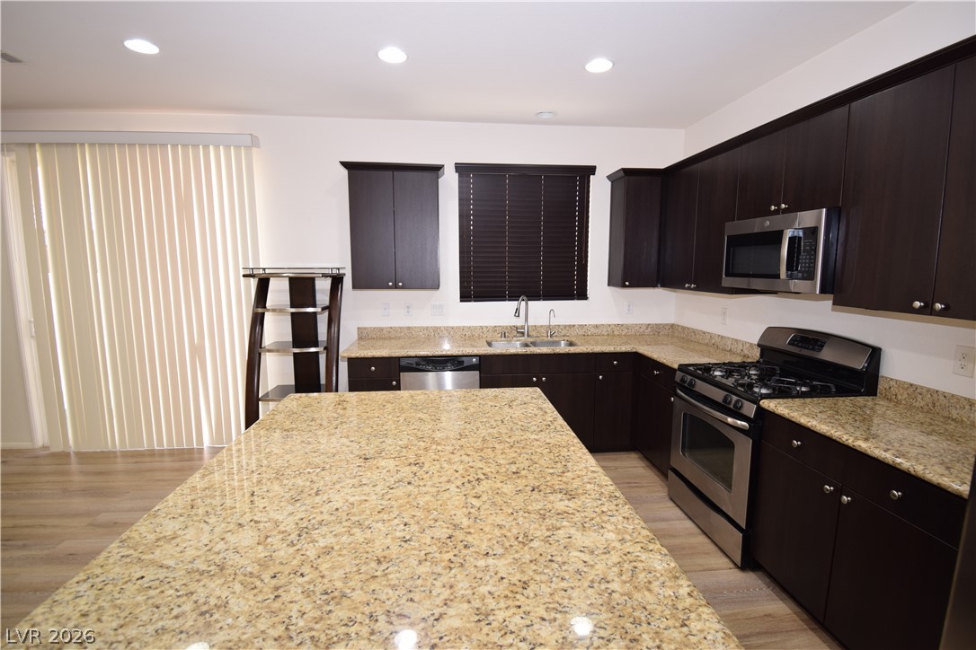 3622 Via Terracina Henderson, NV 89052 - Photo 5 of 22 Culinary delights await in this modern kitchen with extensive counter space and contemporary appliances.