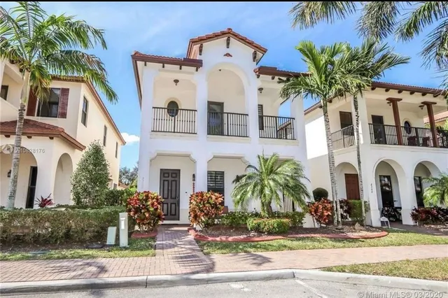 a front view of a house with yard