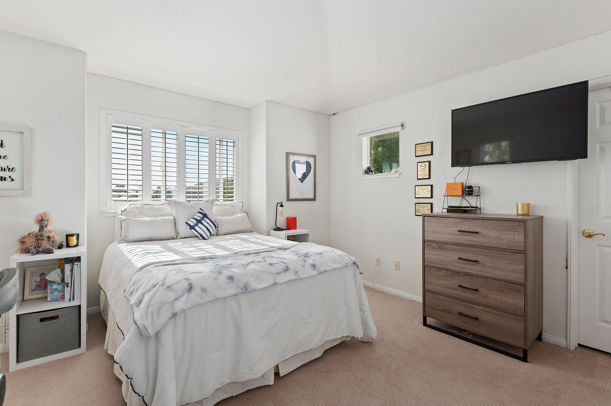 7818 Day Road Goleta, CA 93117 - Photo 12 of 24 a bedroom with a bed and a flat screen tv