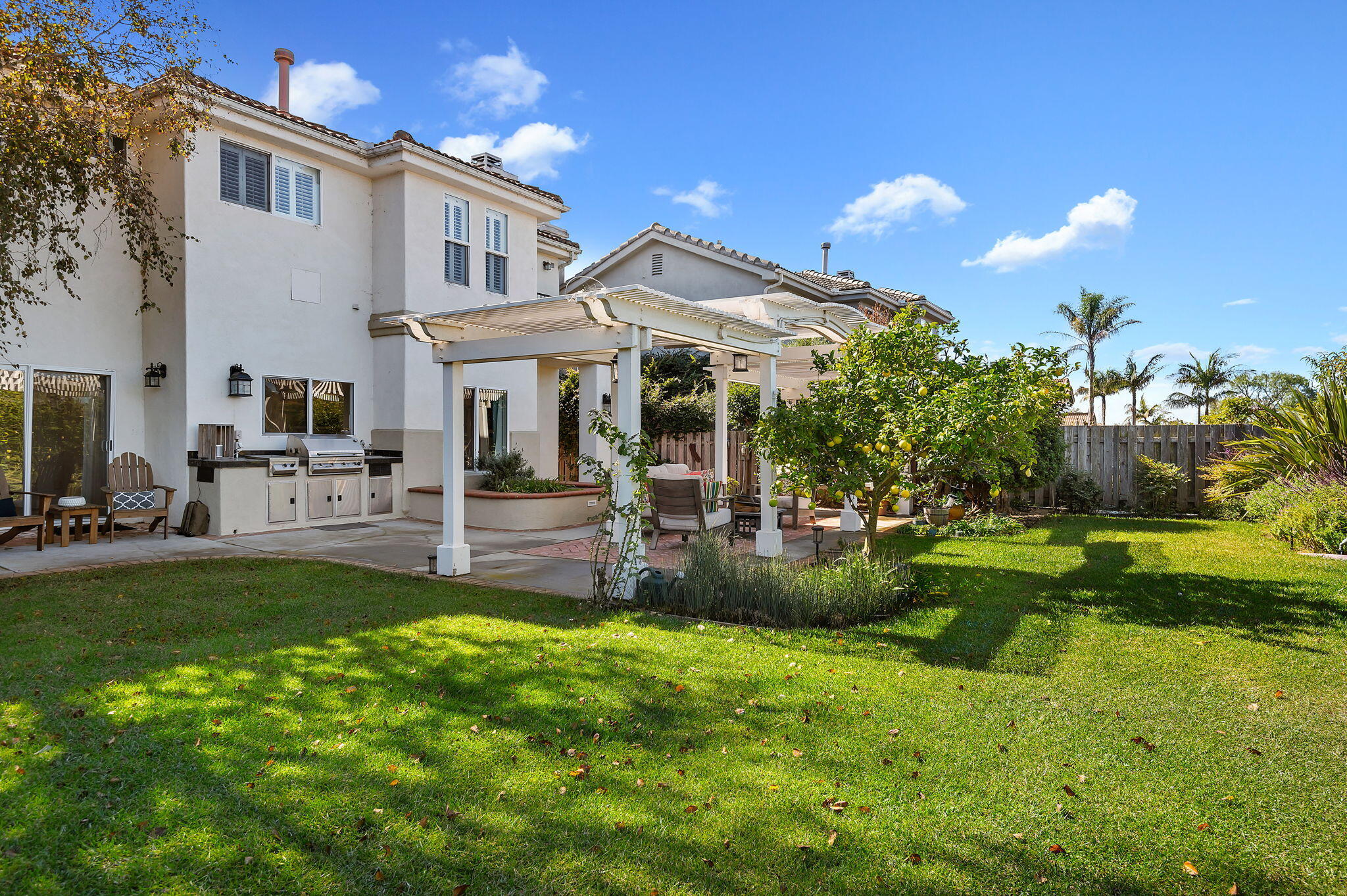 7818 Day Road Goleta, CA 93117 - Photo 18 of 24 a view of a house with a yard and sitting area