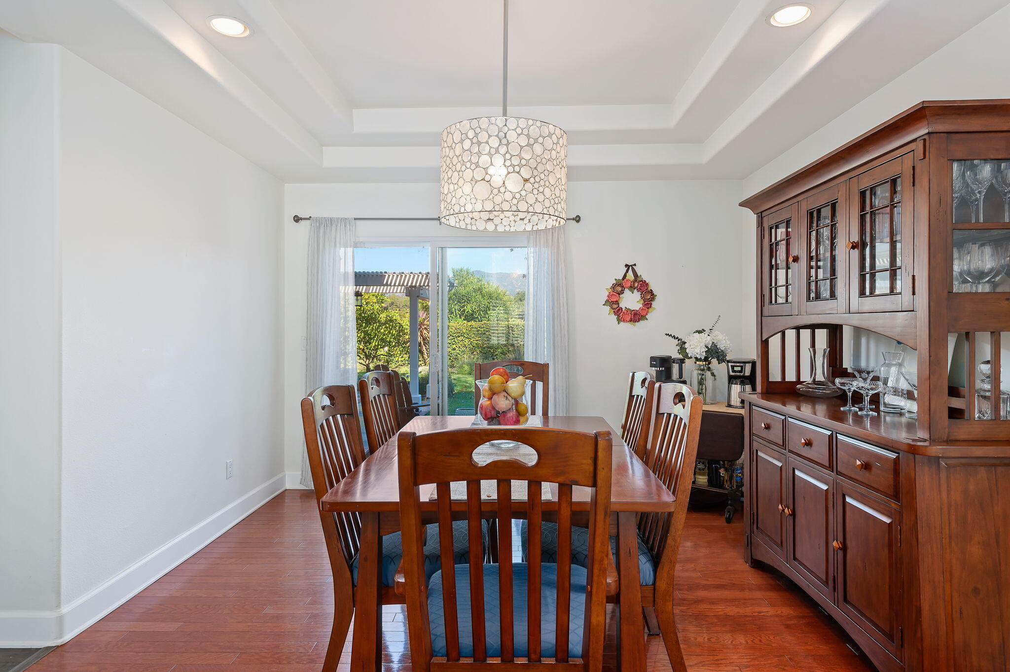 7818 Day Road Goleta, CA 93117 - Photo 5 of 24 a view of a dining room with furniture a chandelier and wooden floor
