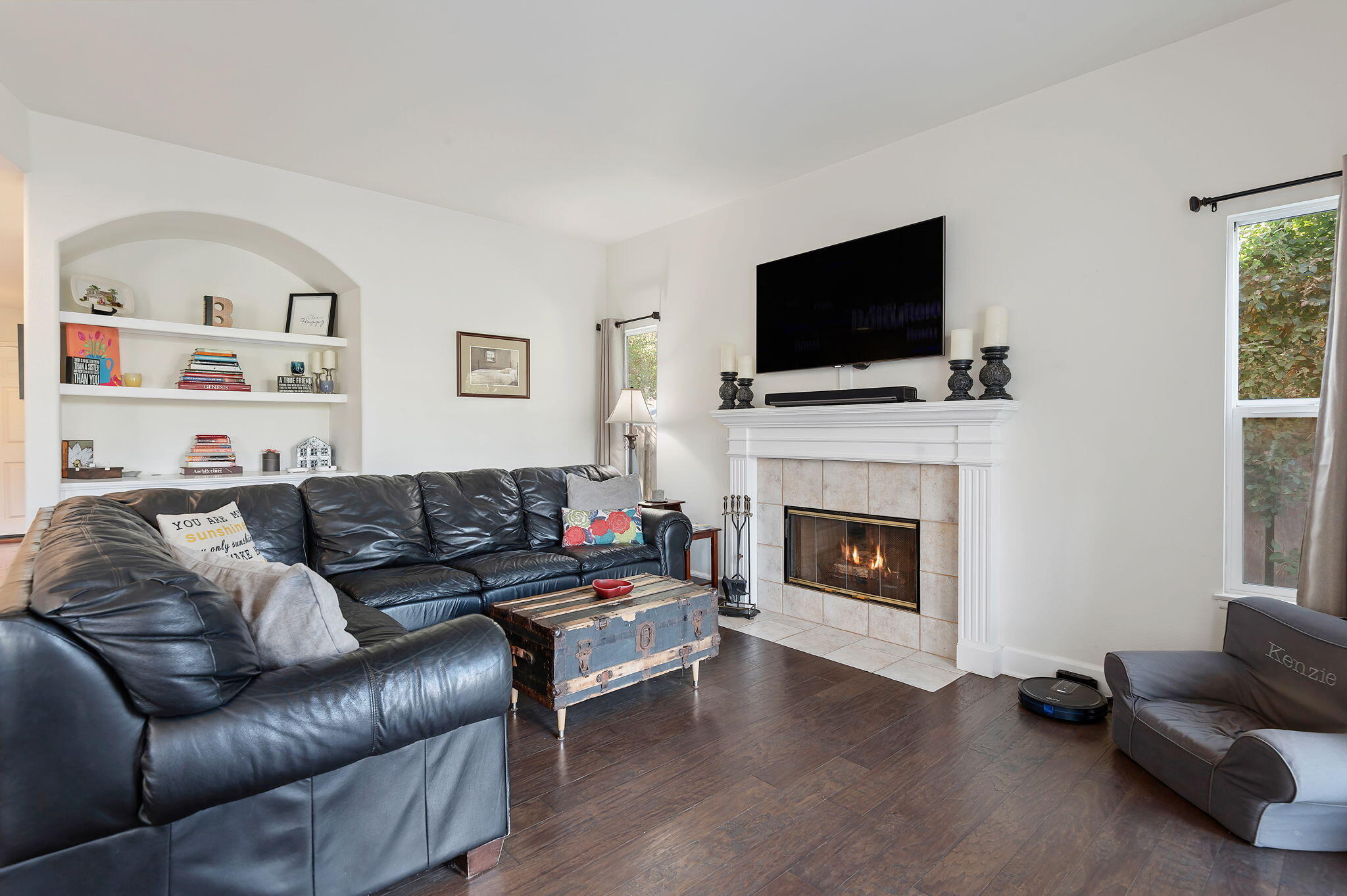 7818 Day Road Goleta, CA 93117 - Photo 8 of 24 a living room with furniture a flat screen tv and a fireplace