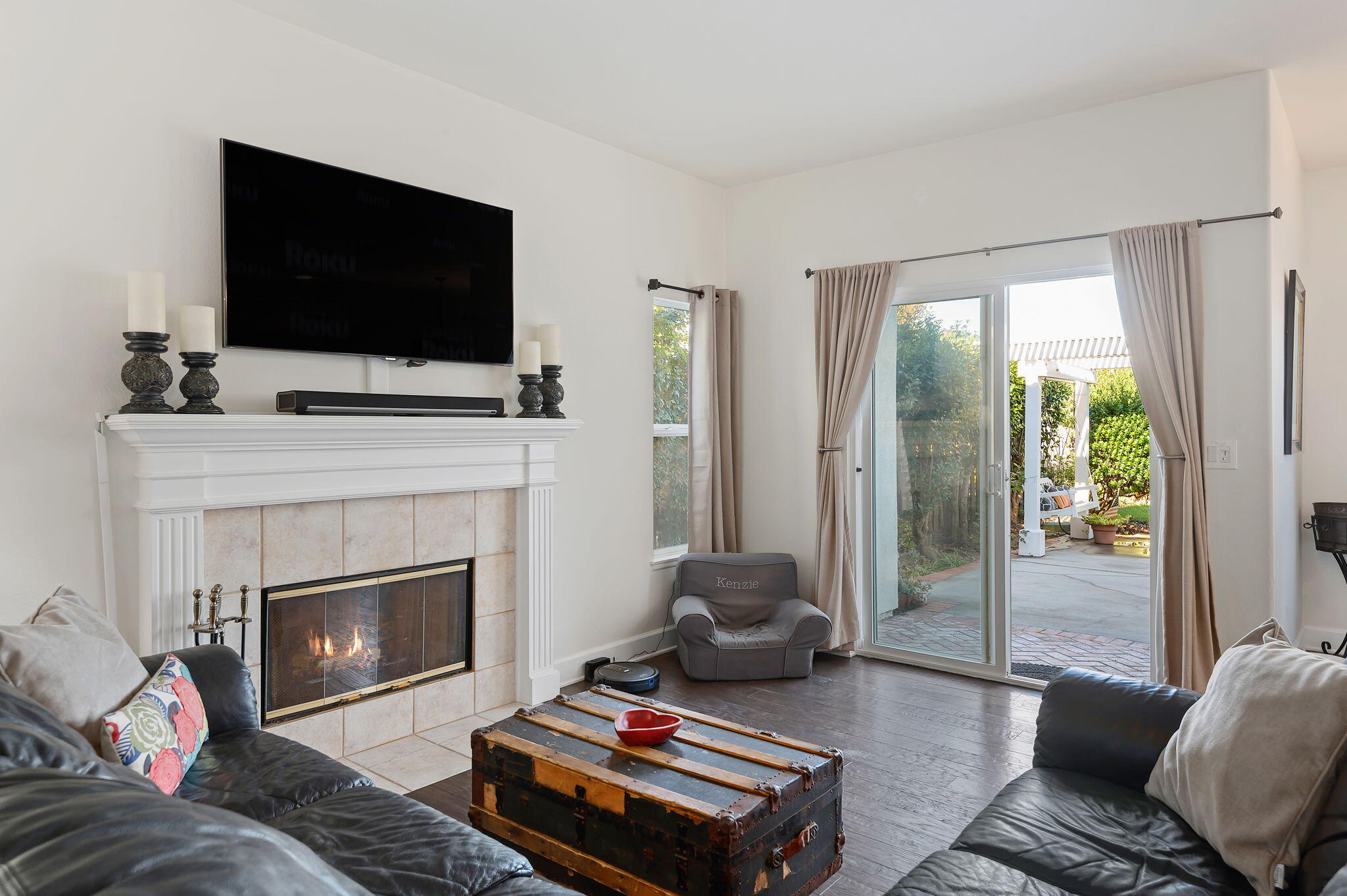 7818 Day Road Goleta, CA 93117 - Photo 9 of 24 a living room with furniture a flat screen tv and a fireplace