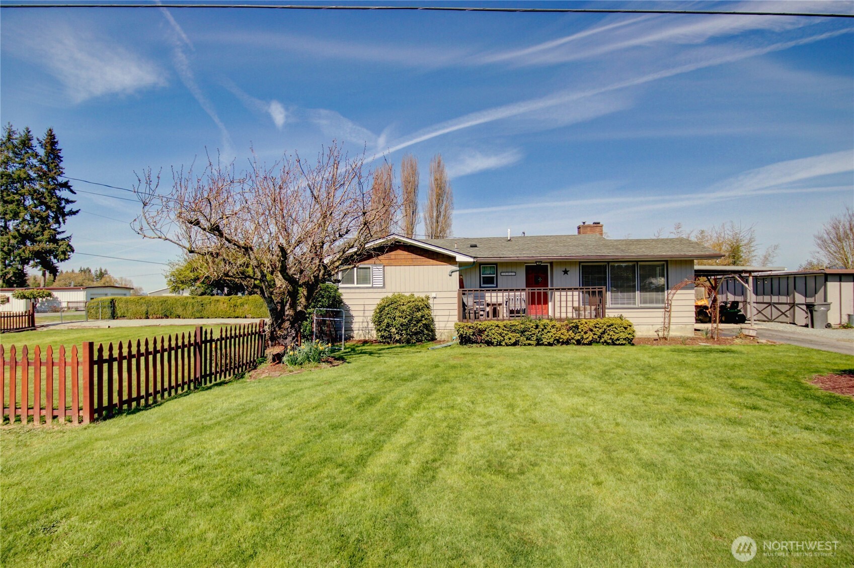 16027 West Division Street Mount Vernon, WA 98273 - Photo 1 of 36 a view of a house with backyard and sitting area