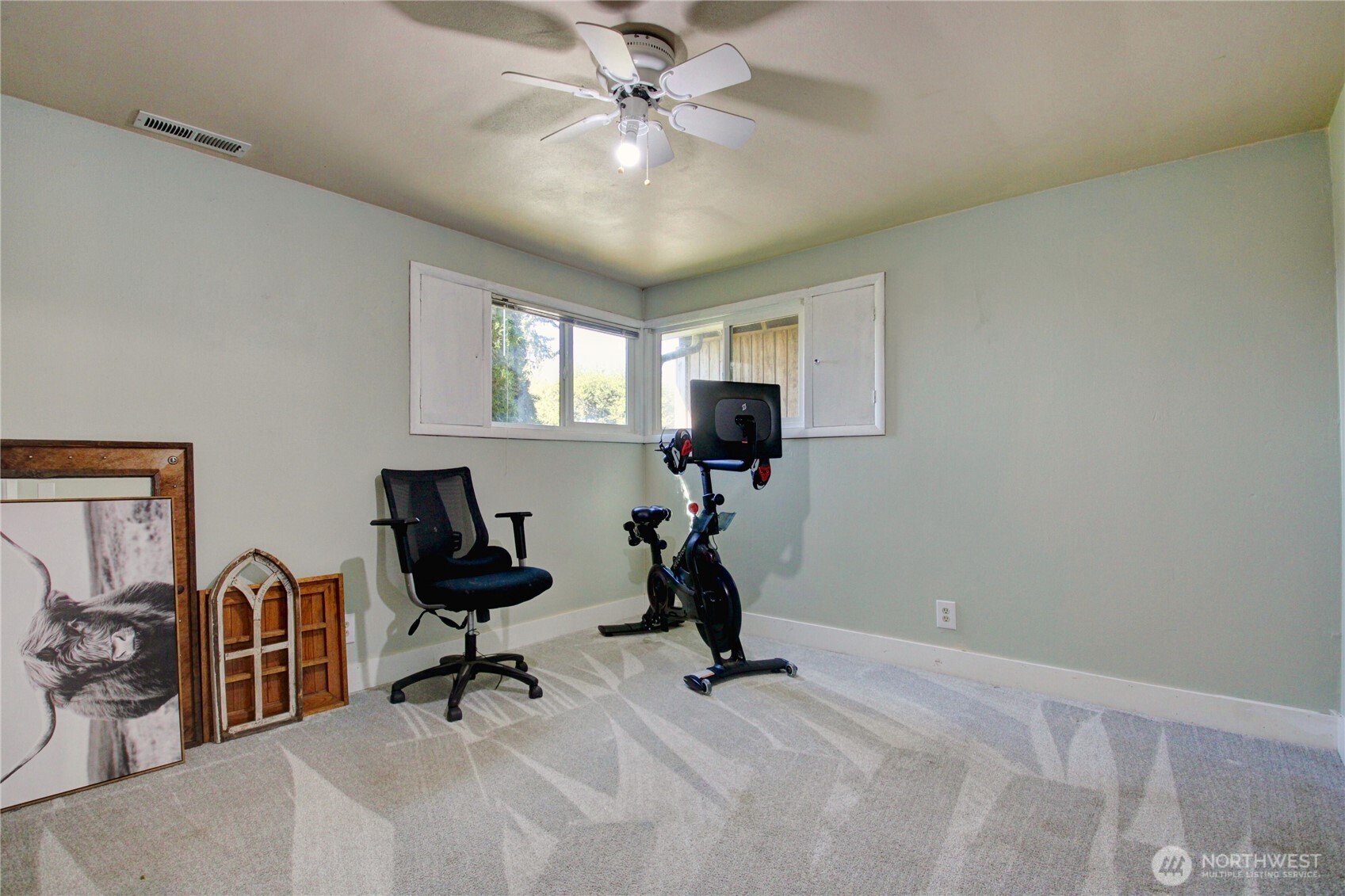 16027 West Division Street Mount Vernon, WA 98273 - Photo 18 of 36 a view of a workspace with furniture and a ceiling fan