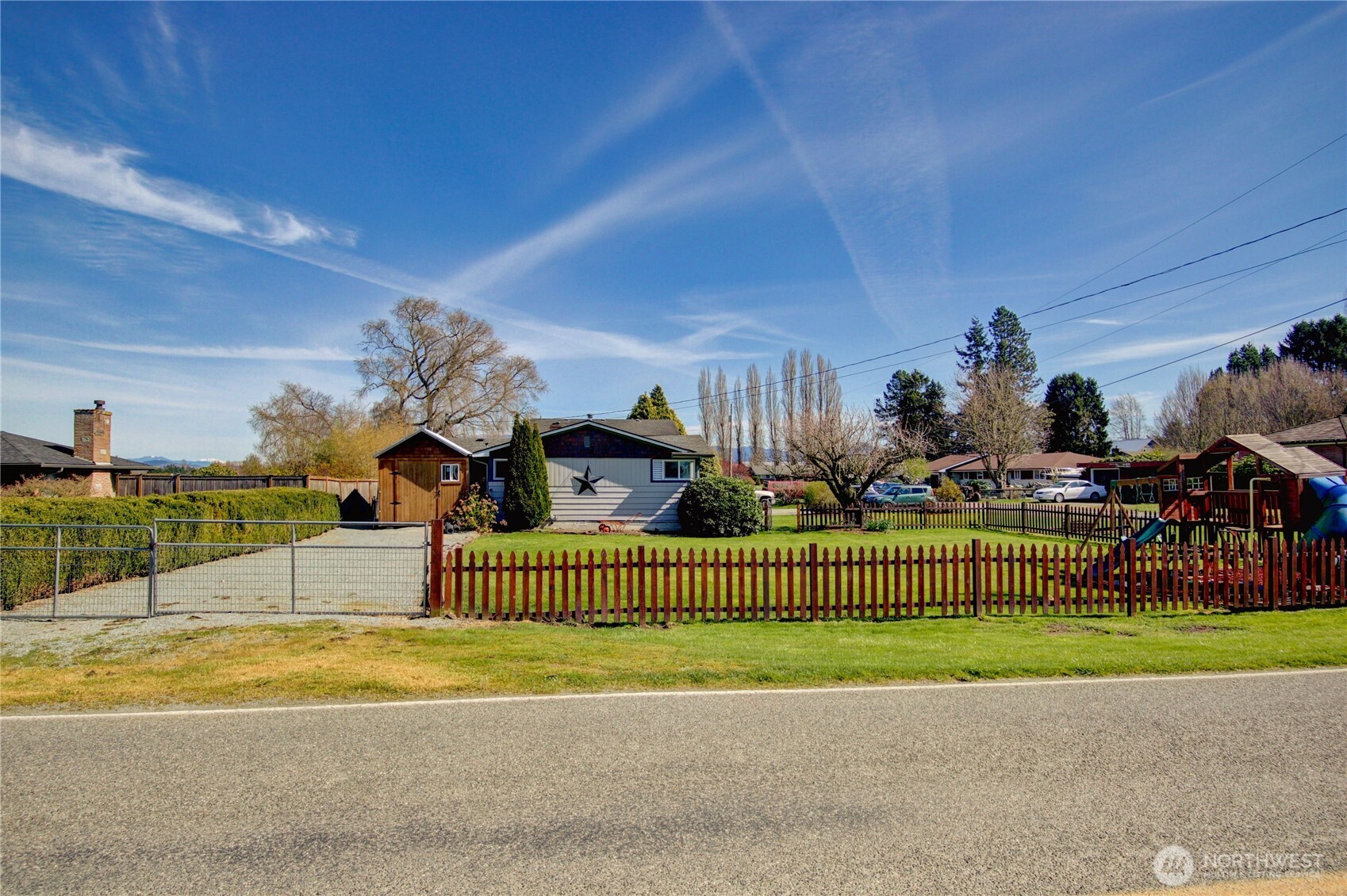 16027 West Division Street Mount Vernon, WA 98273 - Photo 26 of 36 a view of a house with a patio and a garden