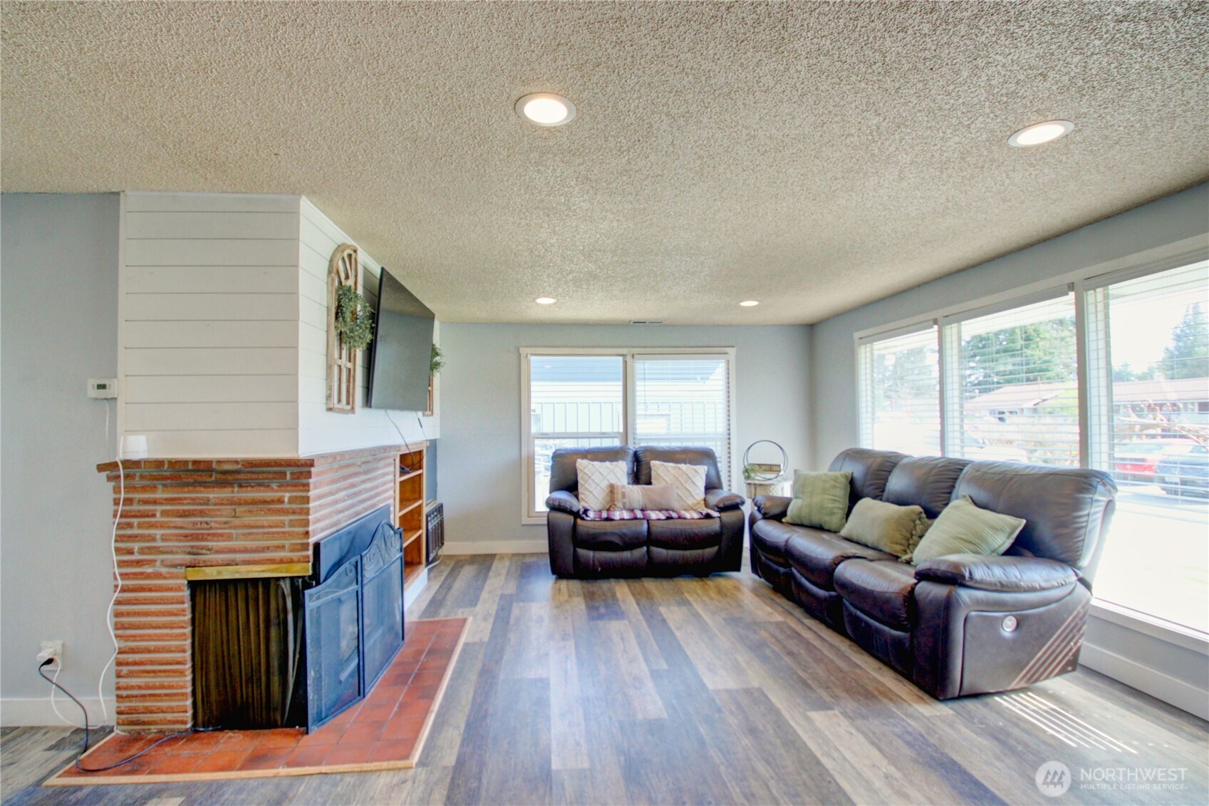 16027 West Division Street Mount Vernon, WA 98273 - Photo 5 of 36 a living room with furniture and a fireplace