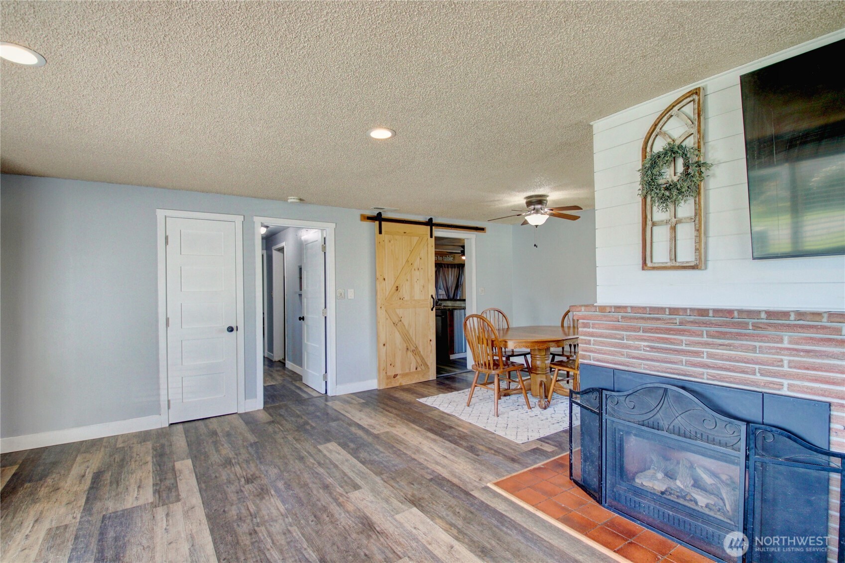 16027 West Division Street Mount Vernon, WA 98273 - Photo 7 of 36 wooden floor in a hall with a dining table and chairs