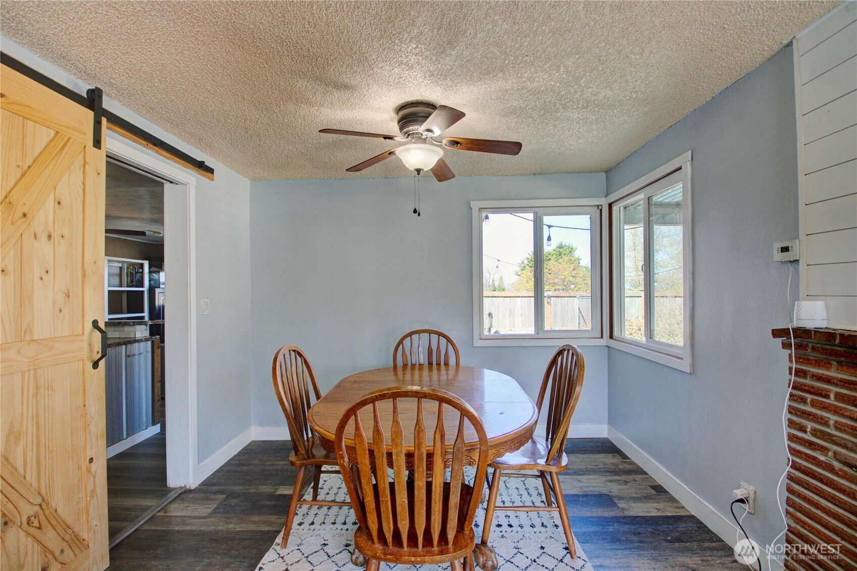 16027 West Division Street Mount Vernon, WA 98273 - Photo 8 of 36 a view of a dining room with furniture window and wooden floor