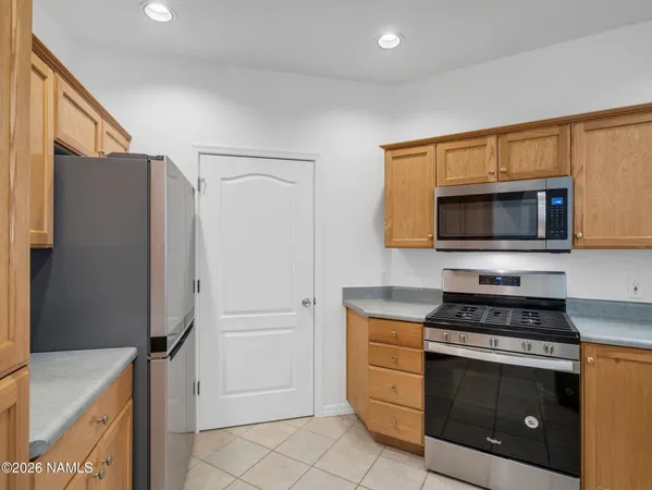 a kitchen with a stove a sink and a refrigerator
