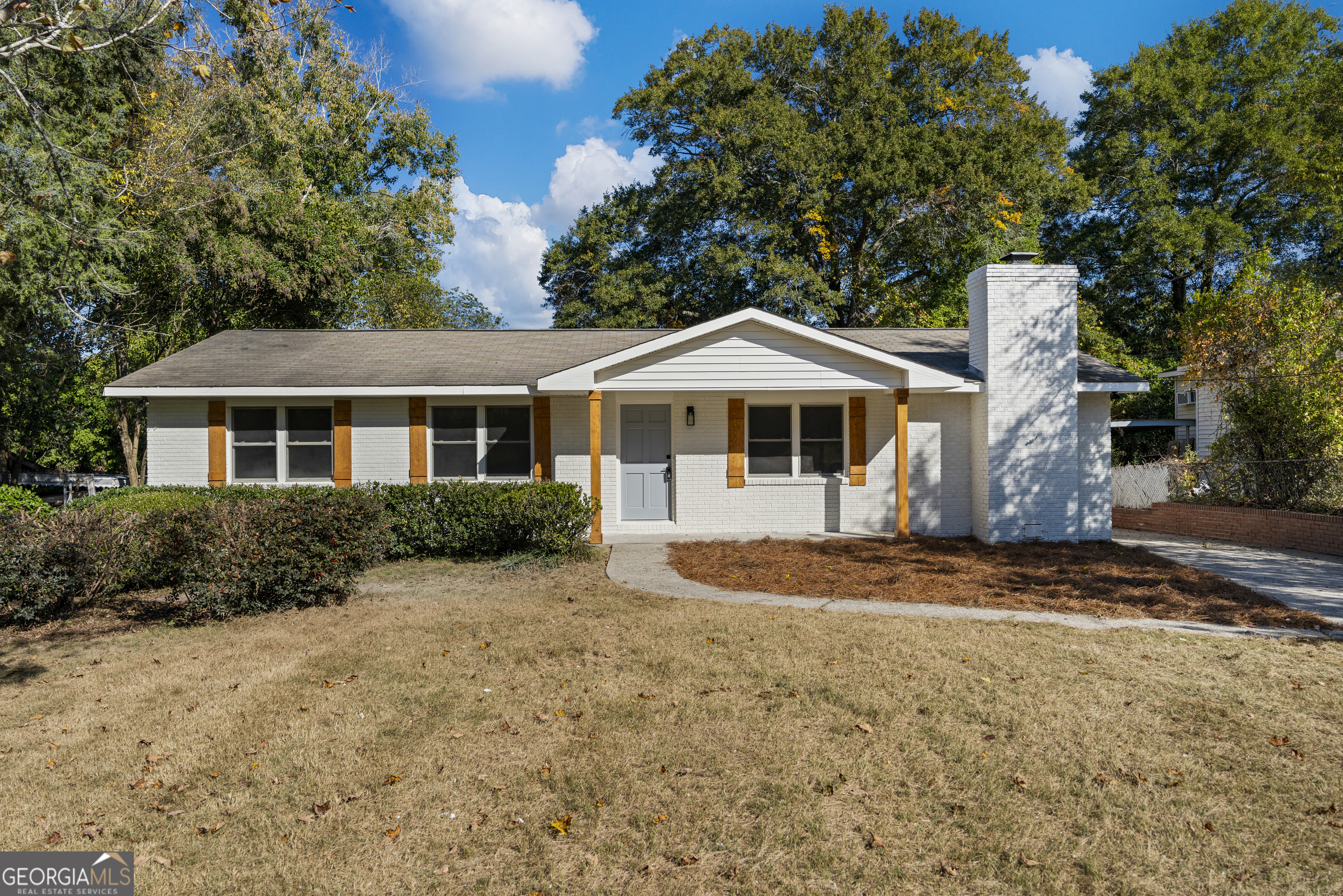4903 Chapman Street Columbus, GA 31907 - Photo 1 of 19 a front view of a house with a yard