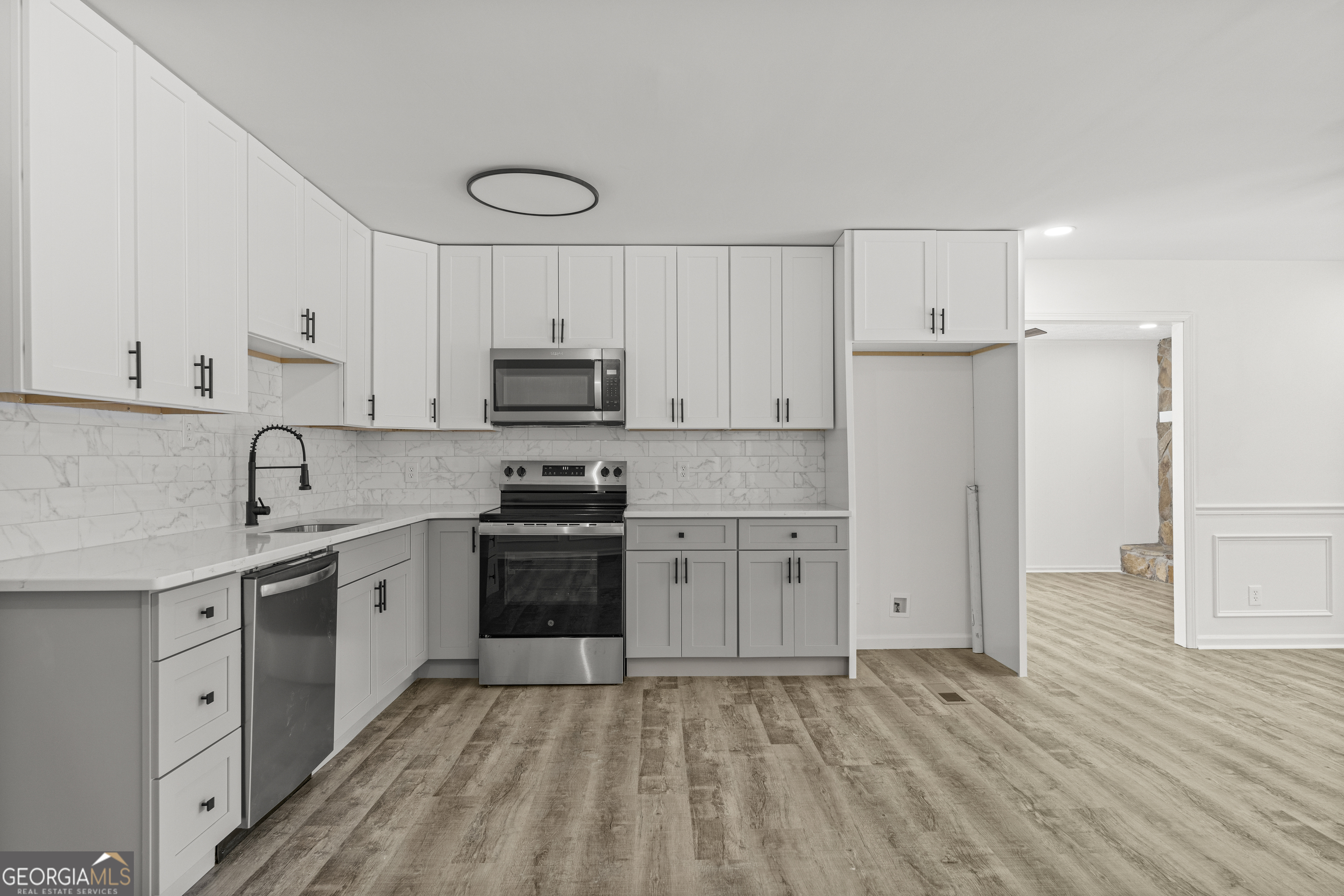 4903 Chapman Street Columbus, GA 31907 - Photo 11 of 19 a kitchen with appliances cabinets and a sink