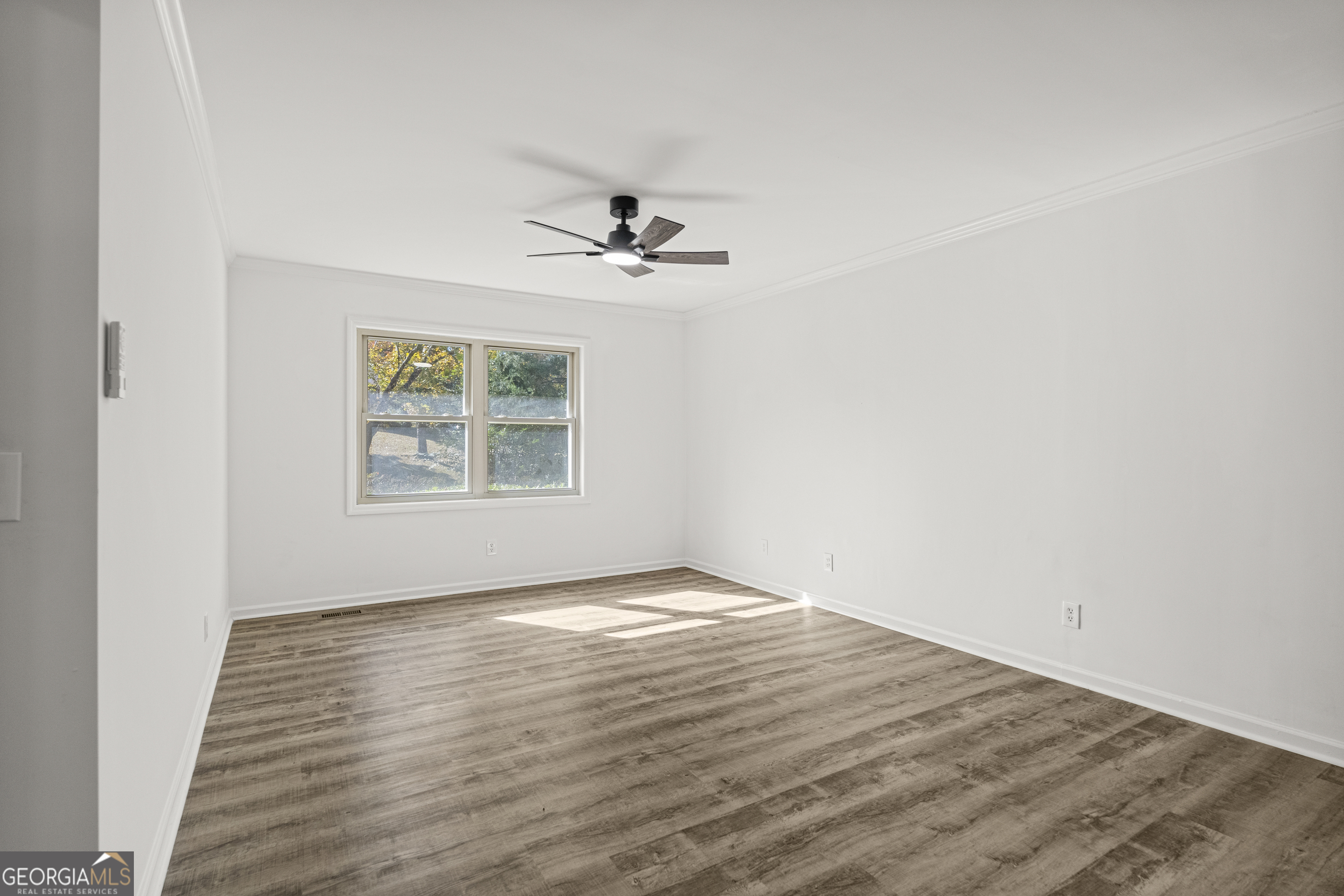 4903 Chapman Street Columbus, GA 31907 - Photo 16 of 19 wooden floor in an empty room with a window