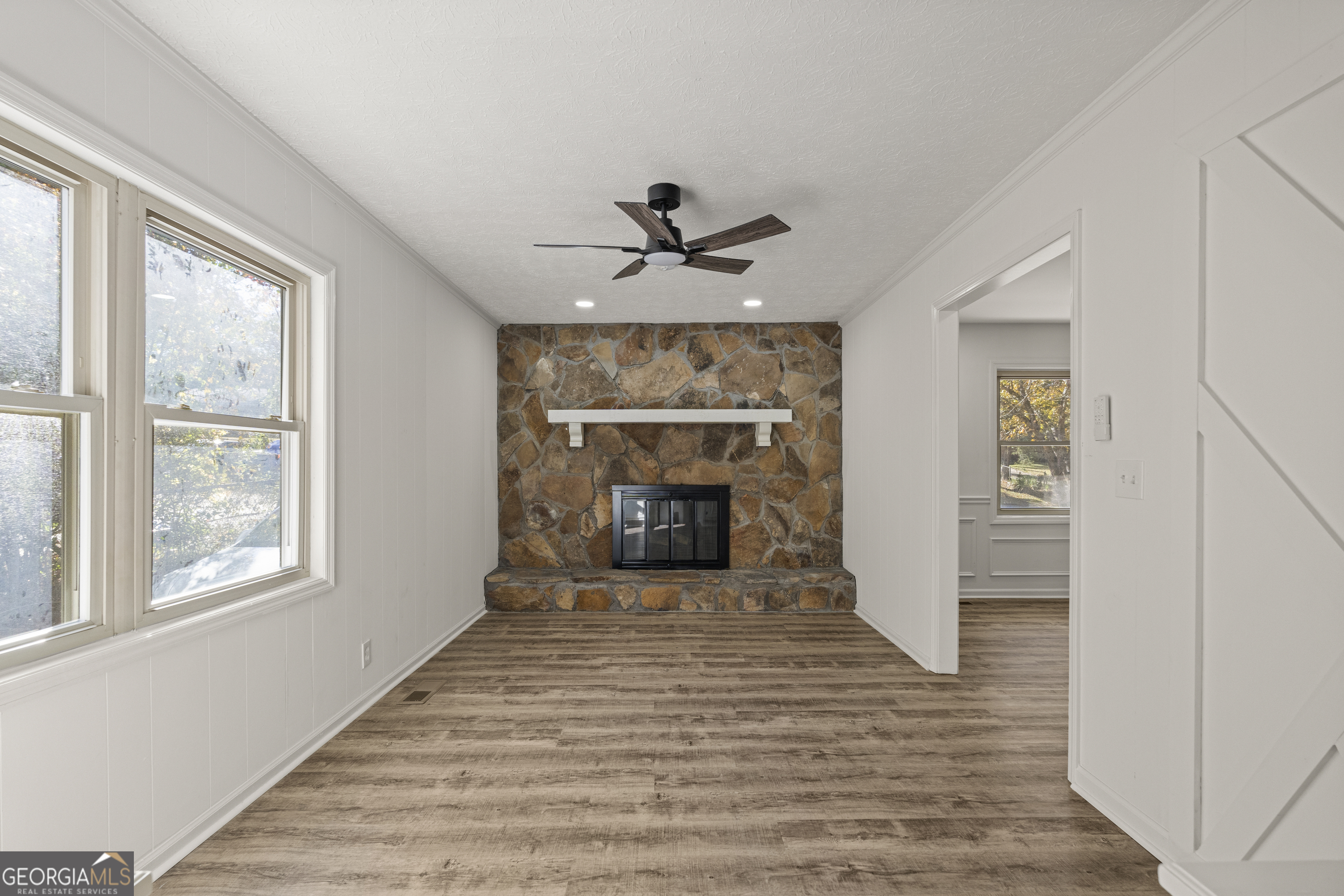 4903 Chapman Street Columbus, GA 31907 - Photo 2 of 19 a view of a livingroom with a fireplace and window