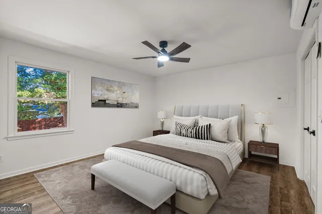 a bedroom with bed and a window