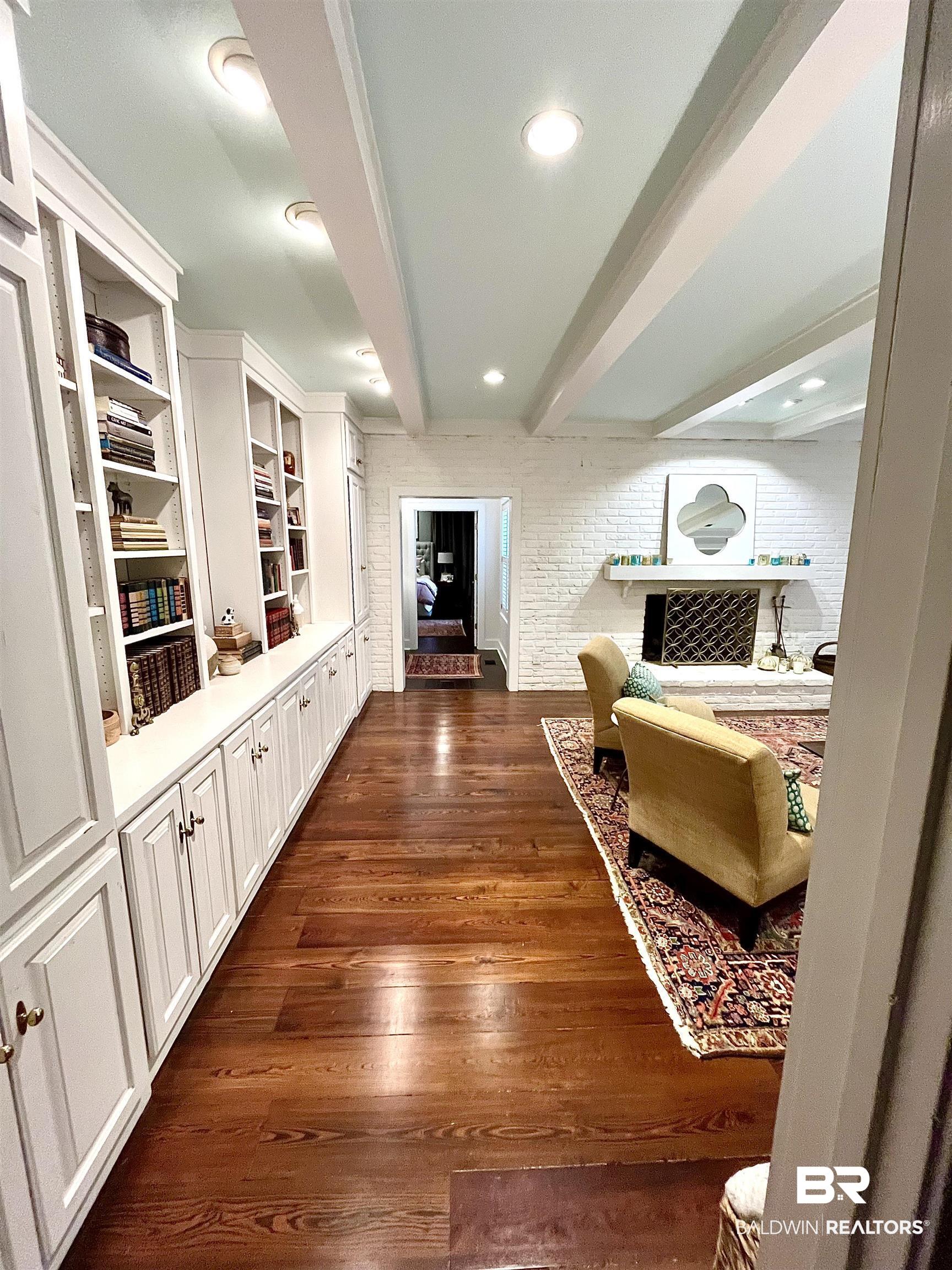 451 Ridgelawn Drive West Mobile, AL 36608 - Photo 20 of 41 Hallway featuring beamed ceiling, dark wood-style flooring, and recessed lighting