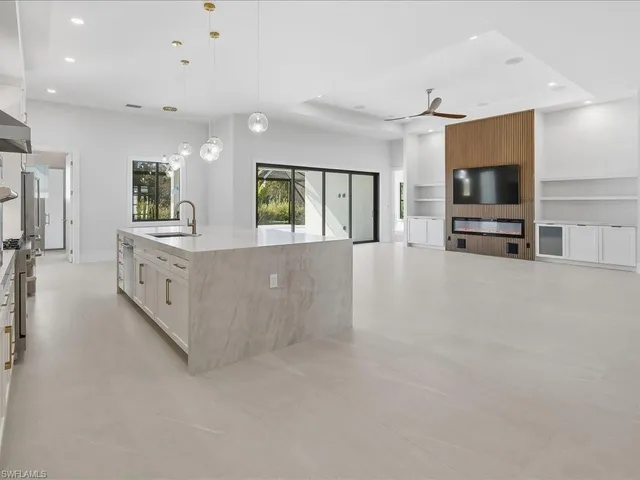 a view of a backyard with swimming pool