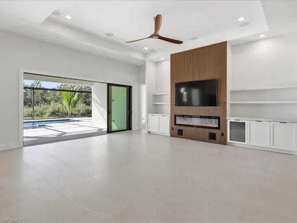 a view of a livingroom with furniture and a flat screen tv