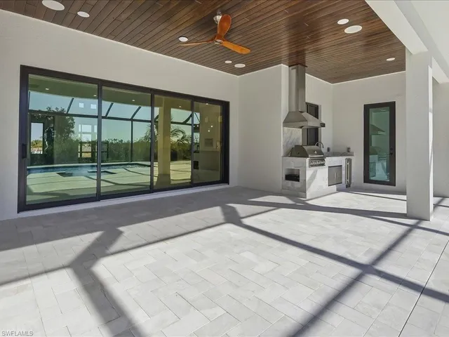 a living room with furniture and a patio
