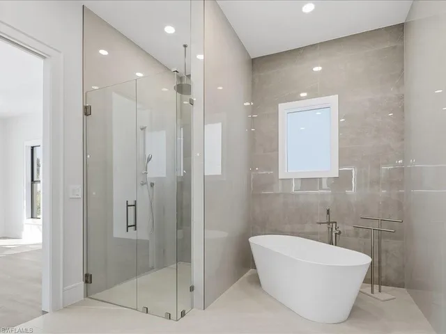 an empty room with wooden floor and closet